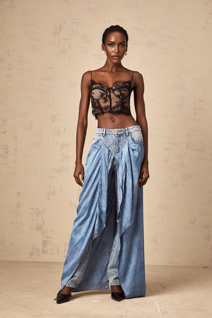 Woman wearing blue layered denim jeans styled with multiple tiers