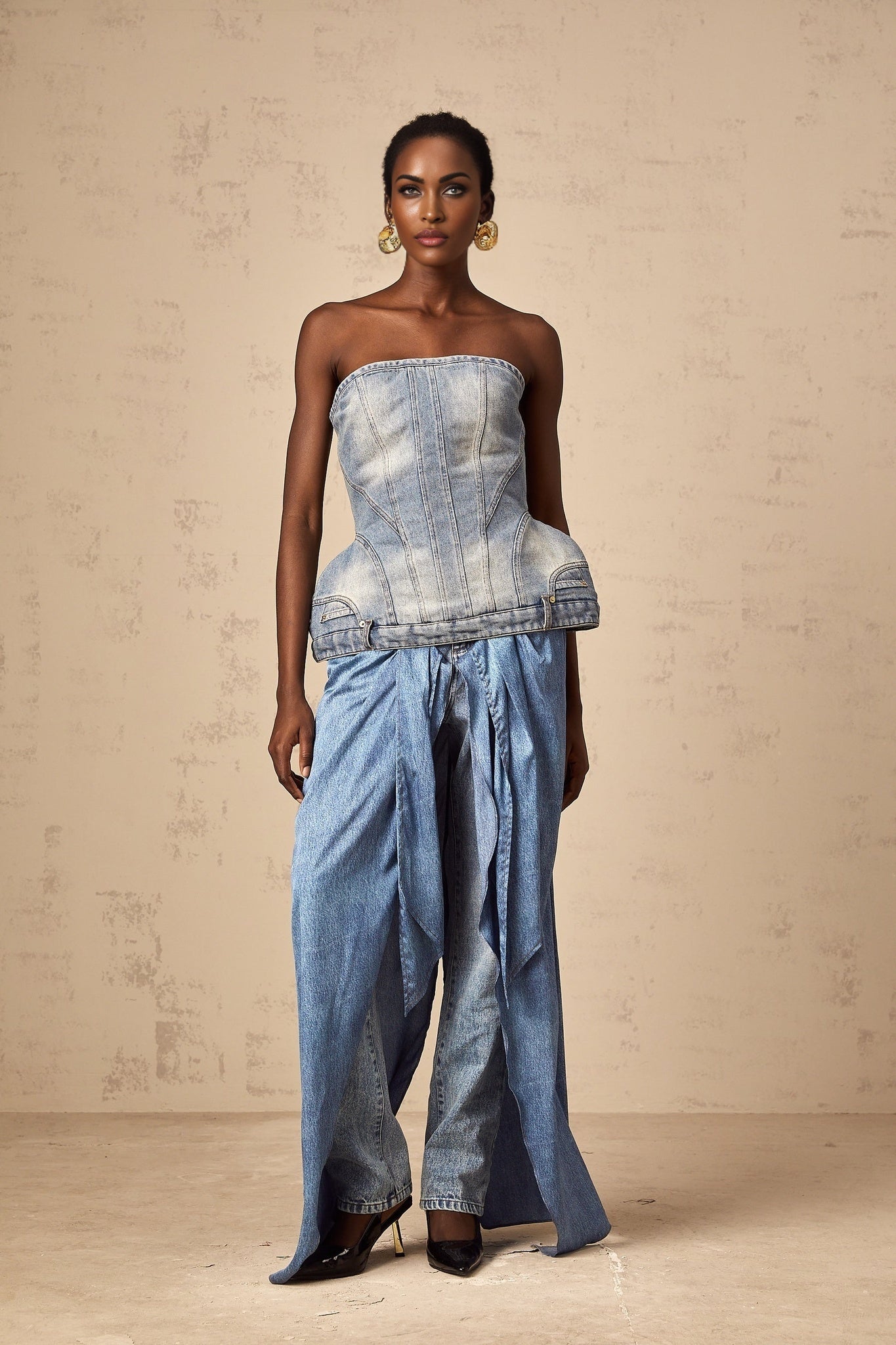 Woman wearing blue off shoulder denim top with long sleeves