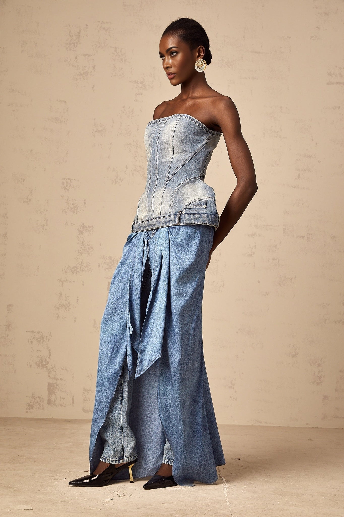 Woman wearing blue off shoulder denim top with relaxed fit