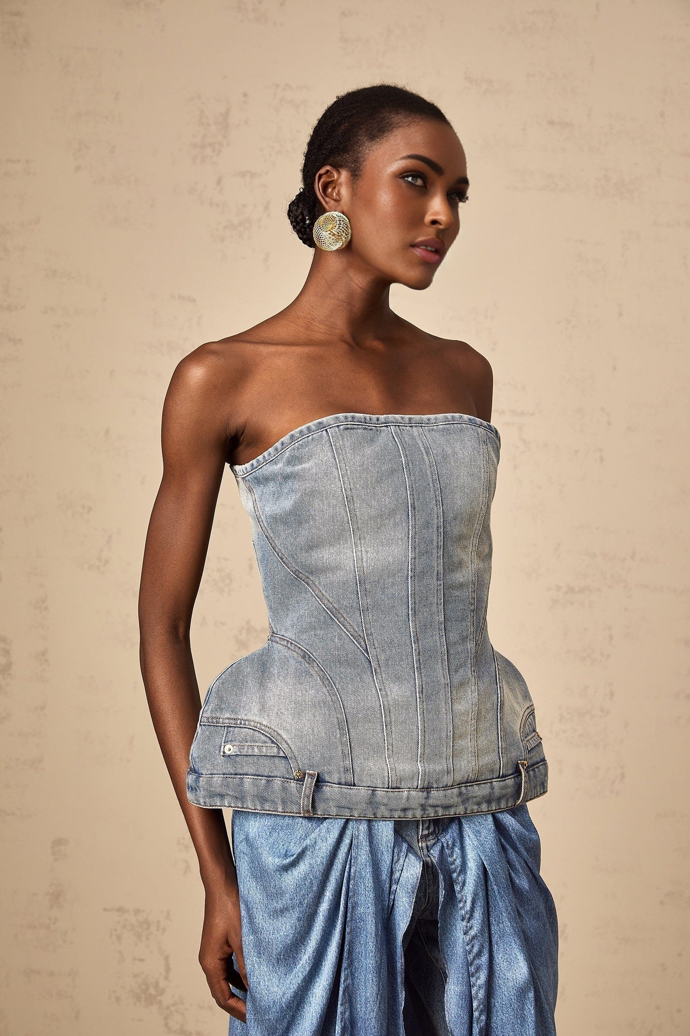 Woman wearing blue off shoulder denim top with short sleeves