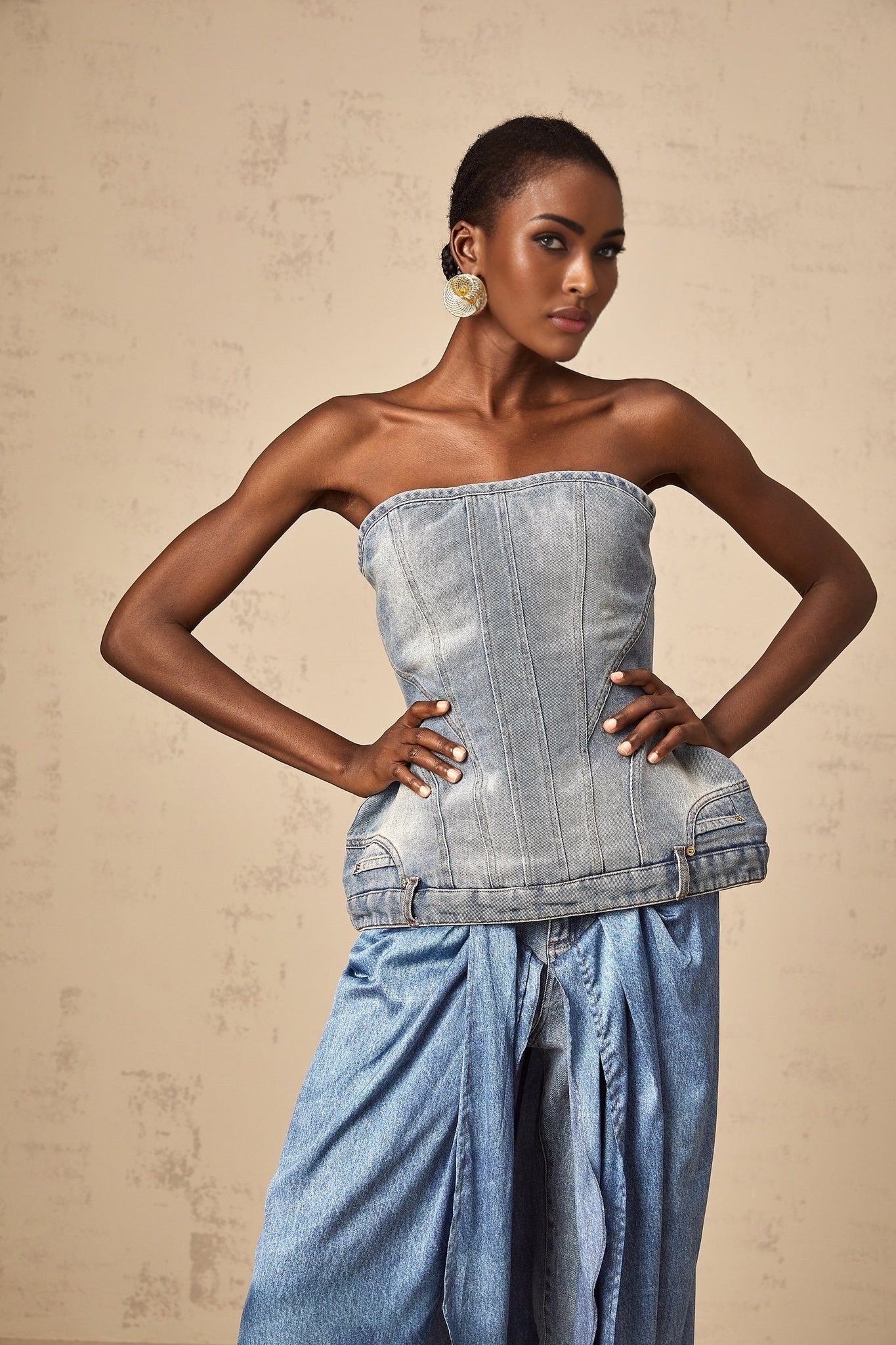 Woman wearing blue off shoulder denim top with short sleeves