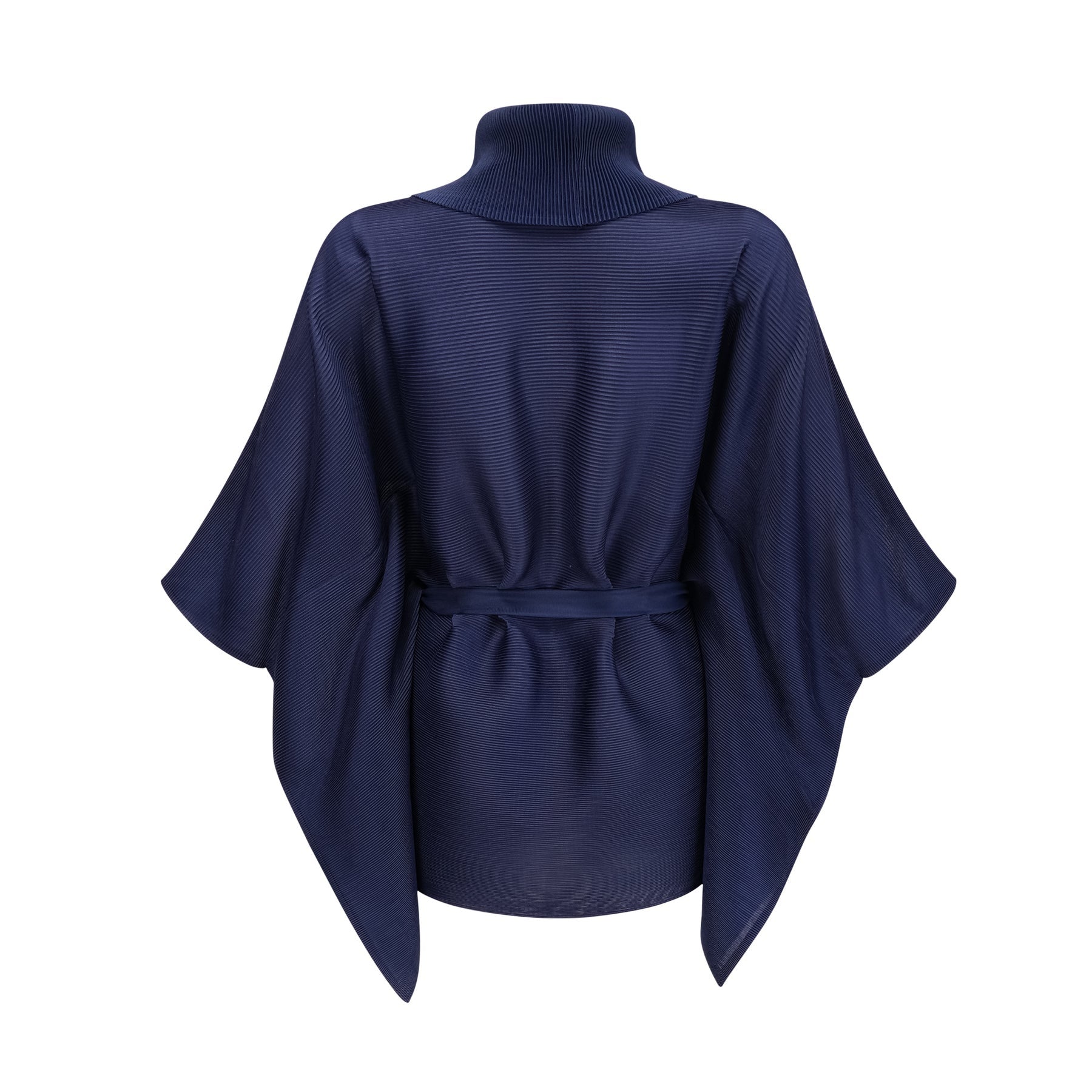 Woman wearing blue patterned cape and matching skirt set with creased texture and allover print design