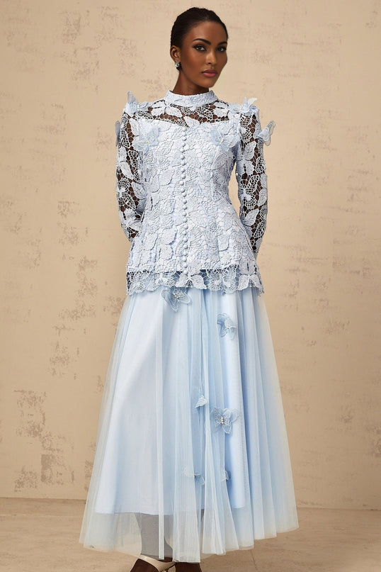 Woman wearing blue sequined lace matching top and skirt set shimmering two piece outfit with delicate lace details