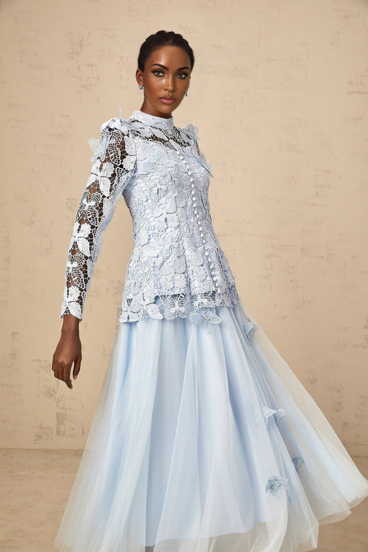 Woman wearing blue sequined lace top and matching skirt set Nicolette outfit shimmering two piece ensemble