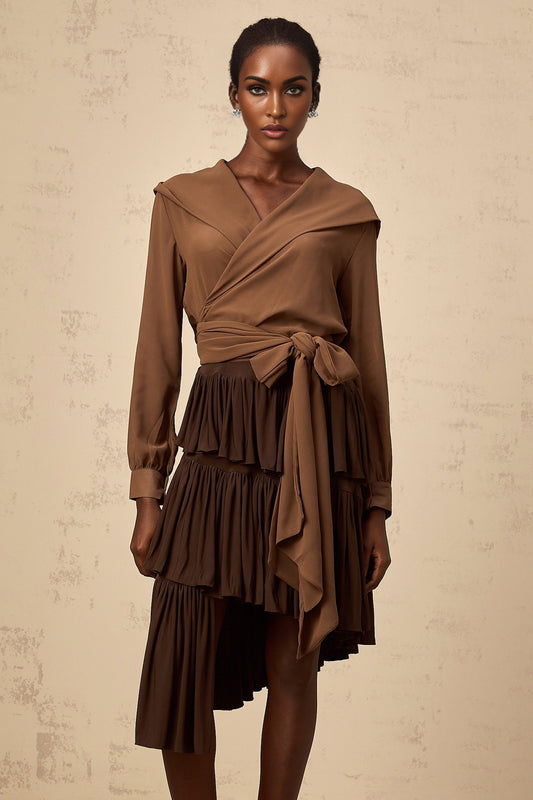 Woman wearing brown semi sheer hooded wrap top with long sleeves and open front design