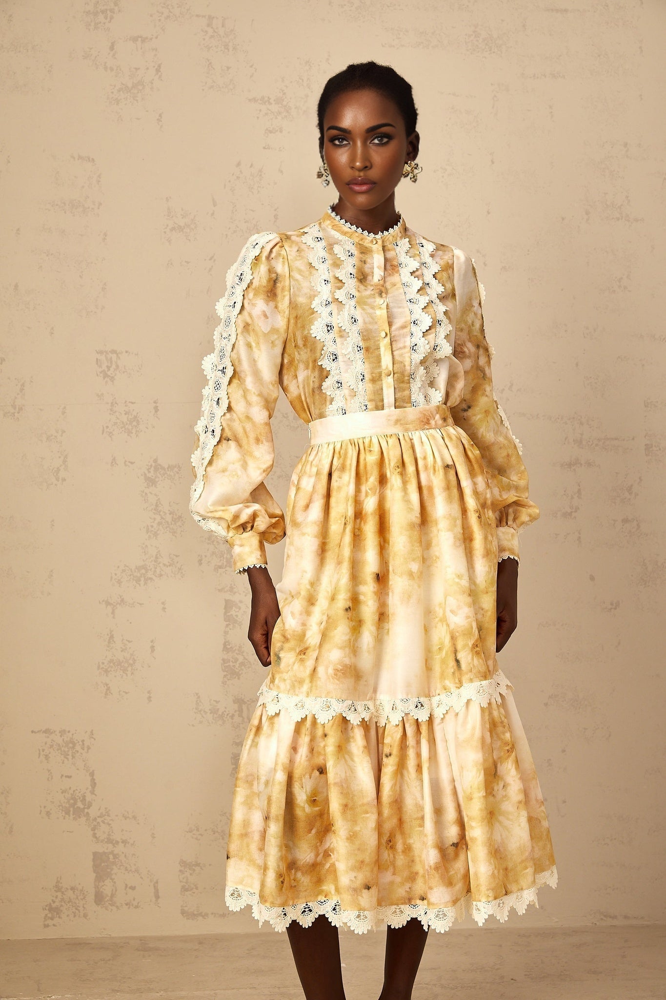 Woman wearing floral print blouse and matching skirt set in Dulcie style