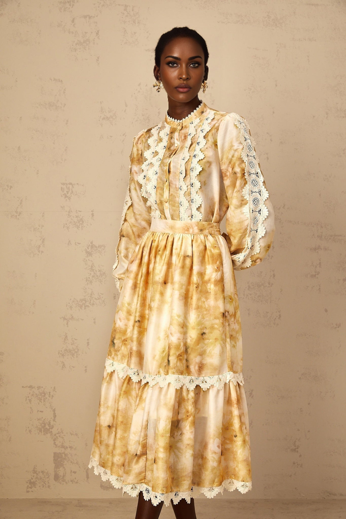 Woman wearing floral print blouse and matching skirt set in pastel colors