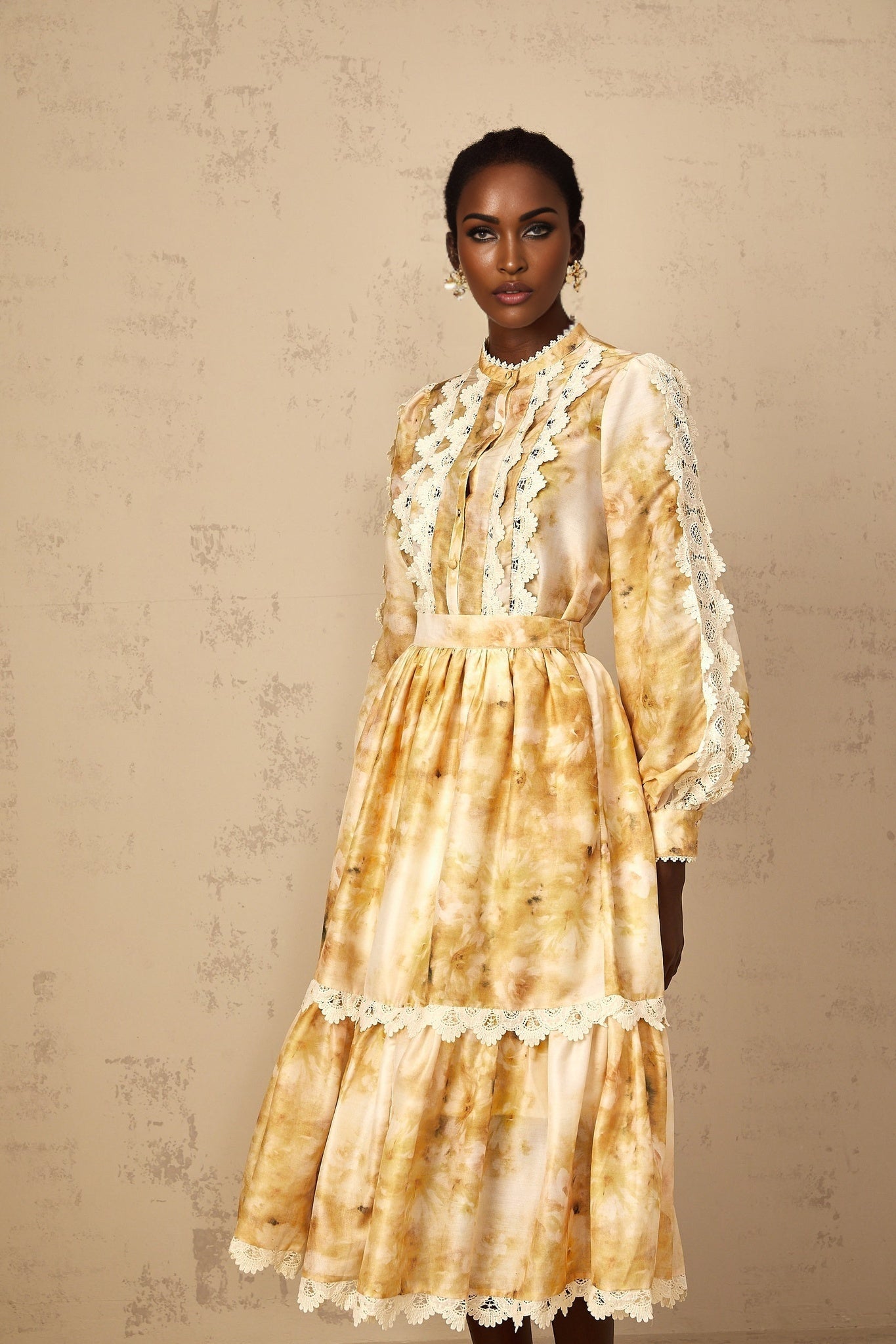 Woman wearing floral print blouse and matching skirt set named Dulcie