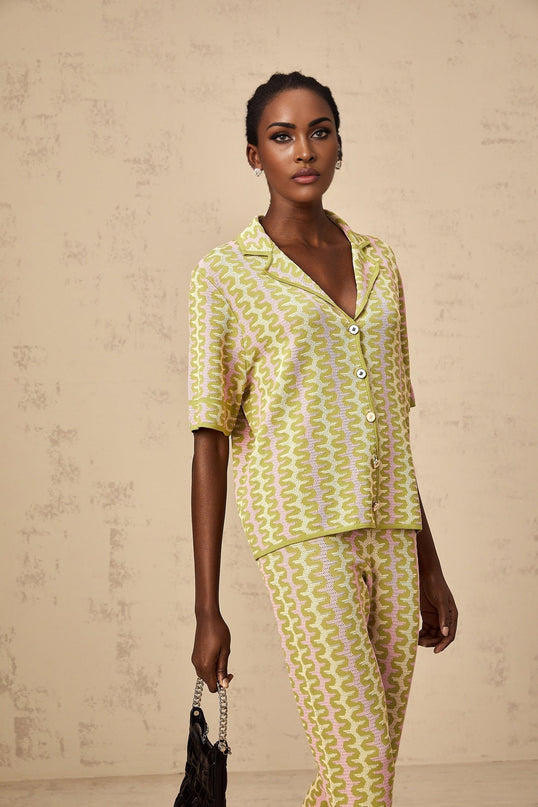 Woman wearing green color block knitted shirt and matching trousers set named Ophelie