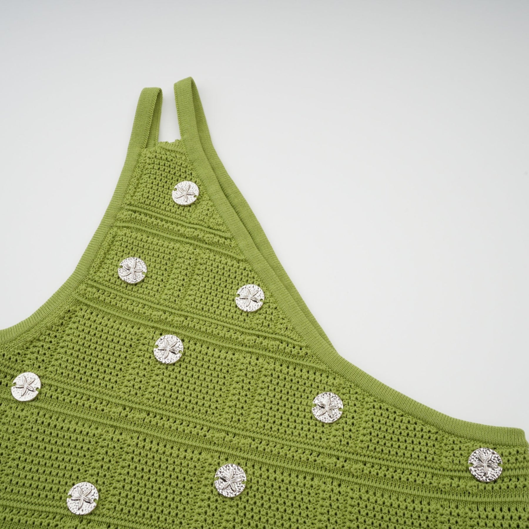 Woman wearing green knit top and skirt set with embellishments Annette matching outfit