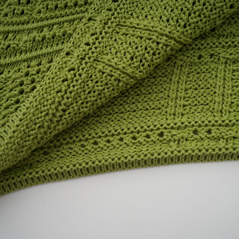 Woman wearing green knit top and skirt set with embellishments Annette matching outfit