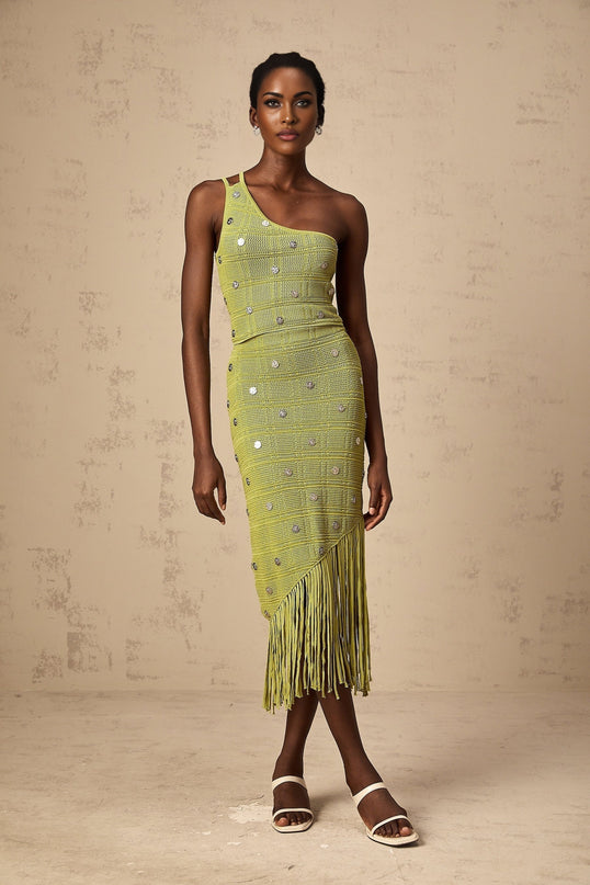 Woman wearing green knit top and skirt set with embellishments Annette style matching outfit