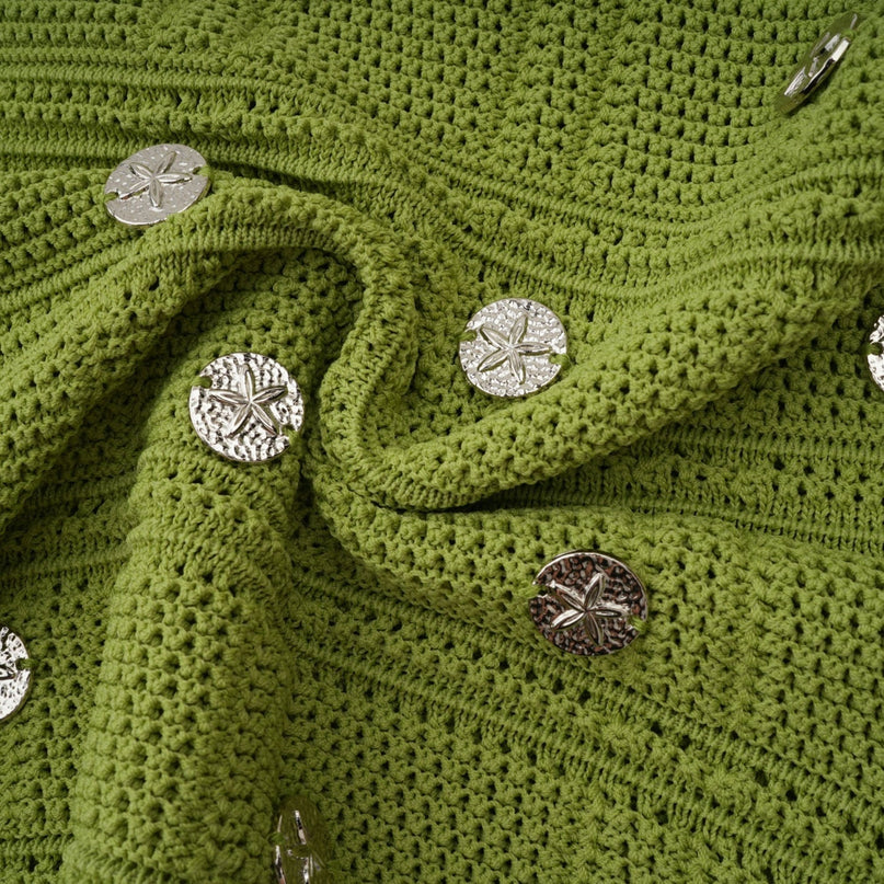 Woman wearing green knit top and skirt set with embellishments Annette style matching outfit