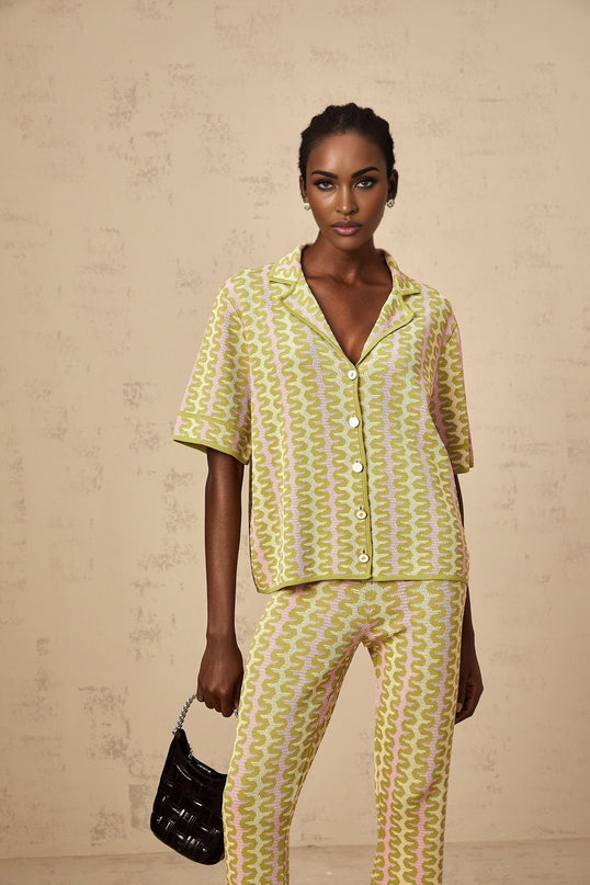 Woman wearing green knitted shirt and matching trousers color block design loungewear set