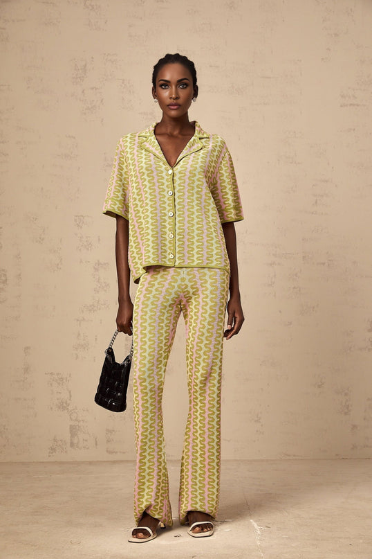 Woman wearing green knitted shirt and matching trousers colorblock design Ophélie set