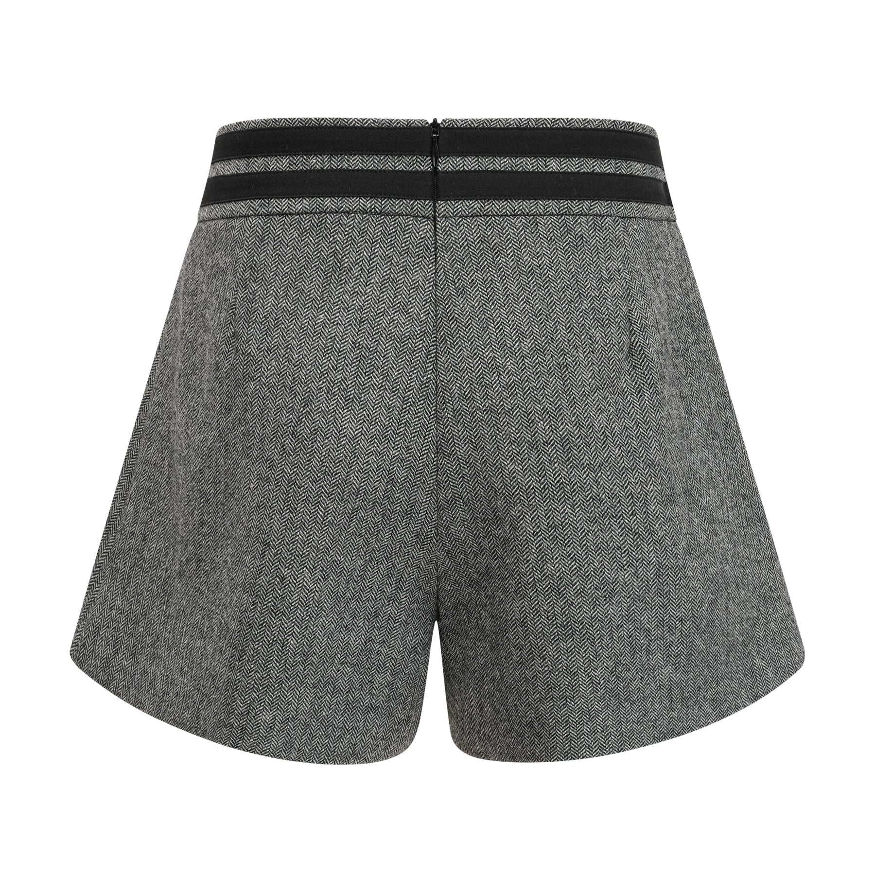 Woman wearing grey herringbone pattern matching top and shorts set