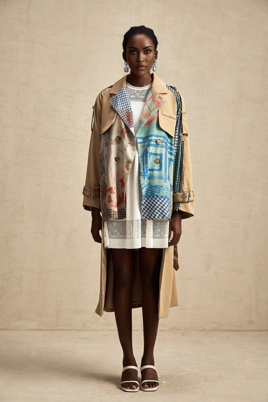 Woman wearing long belted trench coat with contrasting color print design and Josephine style details