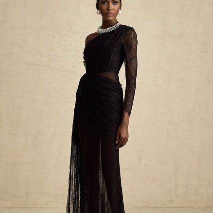 Woman wearing long black one shoulder maxi dress with side cutout detail