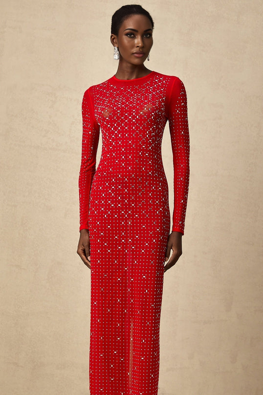 Woman wearing long flowing red tulle maxi dress with rhinestone embellishments