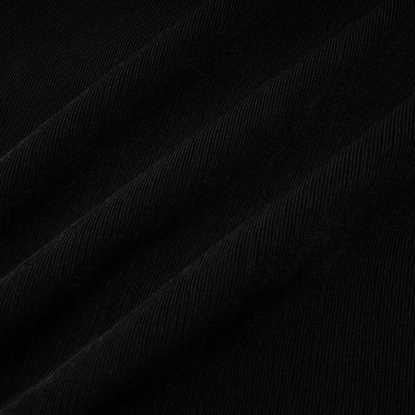 Woman wearing long flowy maxi dress with contrasting colors and bowknot detail at vneckline