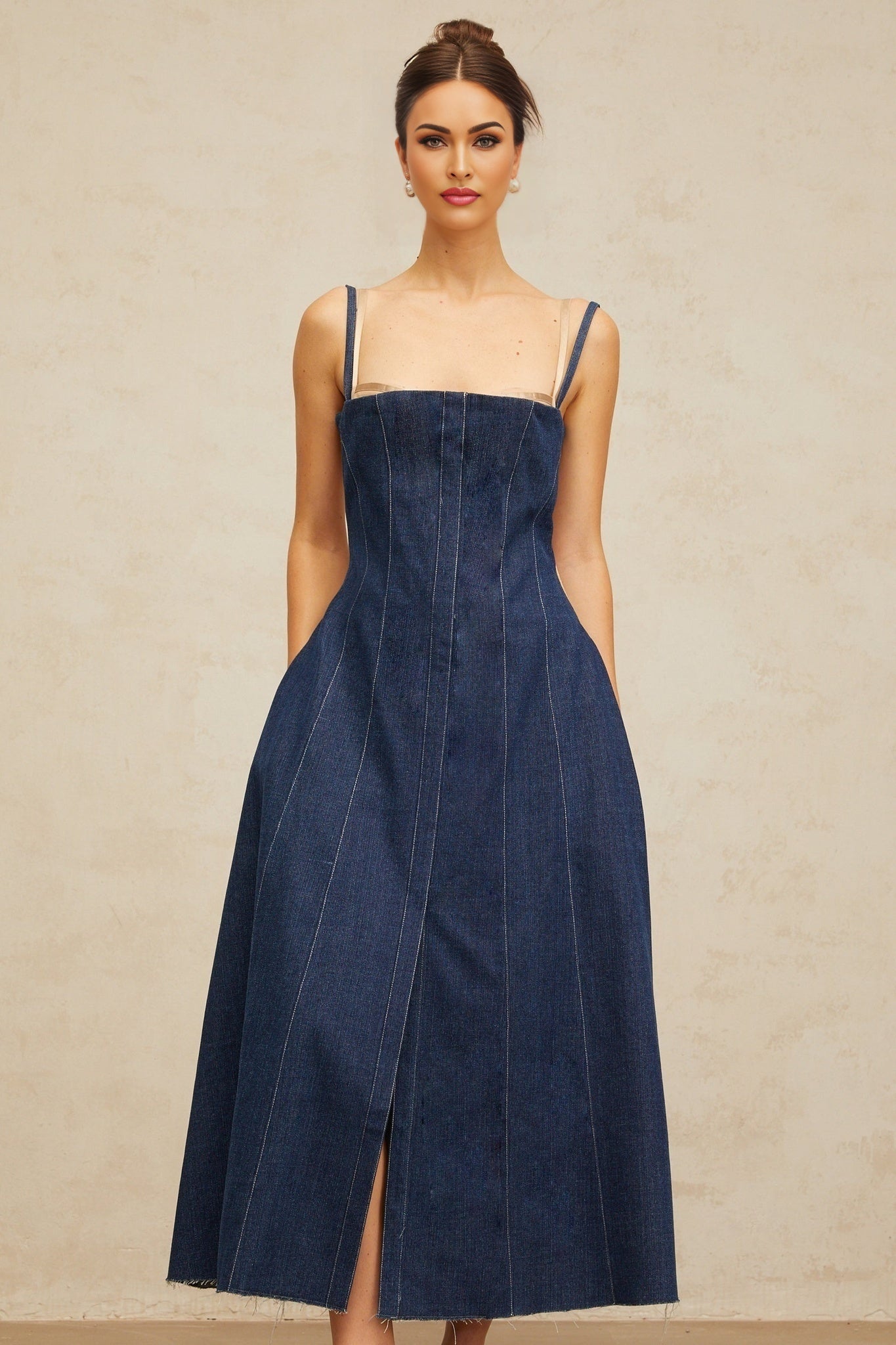 Woman wearing long indigo blue denim dress with panels and midi length
