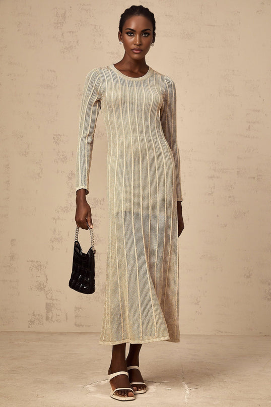 Woman wearing long khaki knit dress with fitted silhouette and midi length