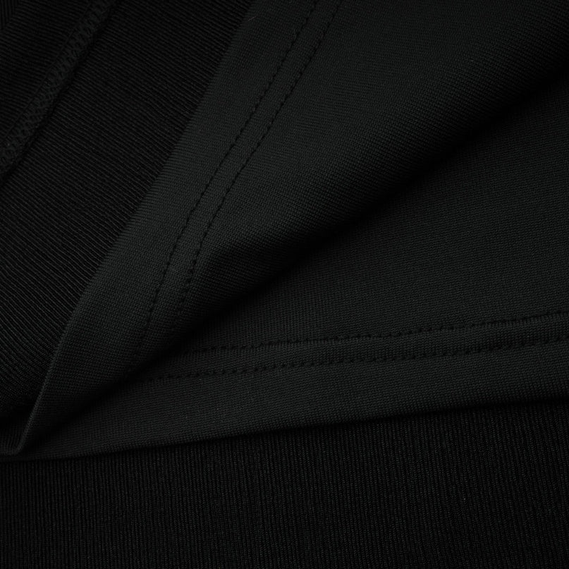 Woman wearing long maxi dress with contrasting colors and bowknot detail at vneckline