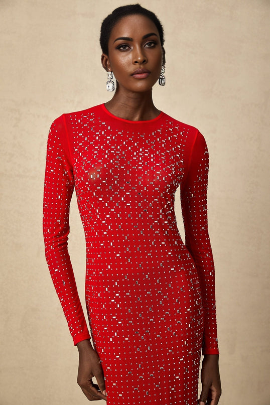 Woman wearing long red maxi dress with tulle skirt and rhinestone embellishments