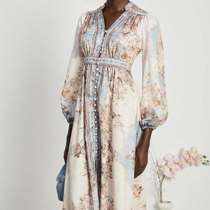 Woman wearing long sleeve floral print dress with bohemian style and flowing skirt