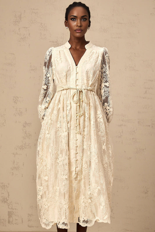 Woman wearing neutral colored midi dress with lace embroidery details