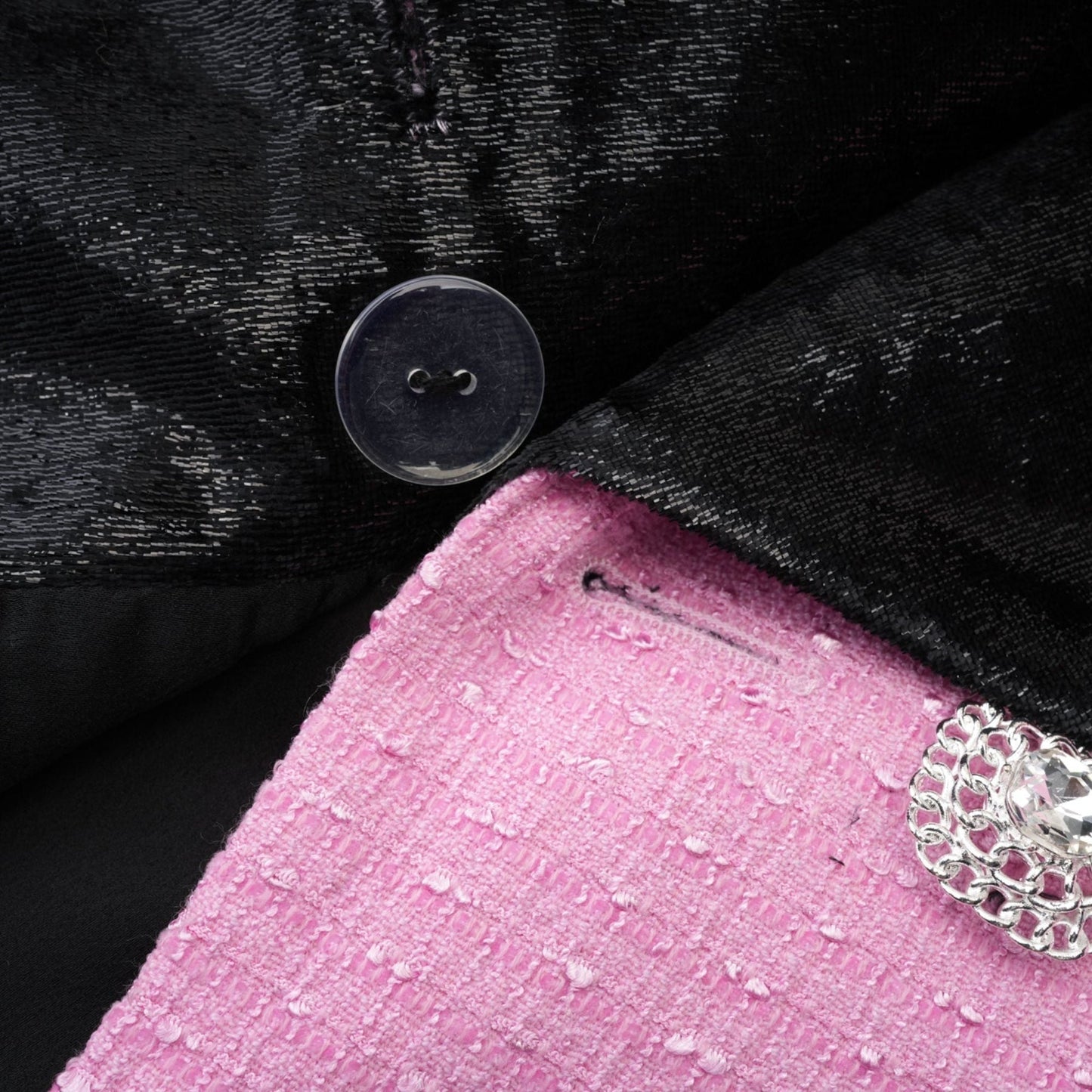 Pink jacket with Vshaped collar fulllength sleeves front button closures and fitted waist design