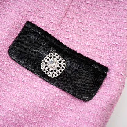 Pink jacket with fulllength sleeves Vshaped collar and button closures made of 80% Polyester 20% Cotton