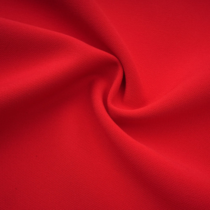 Woman wearing red long sleeve dress with floral pattern