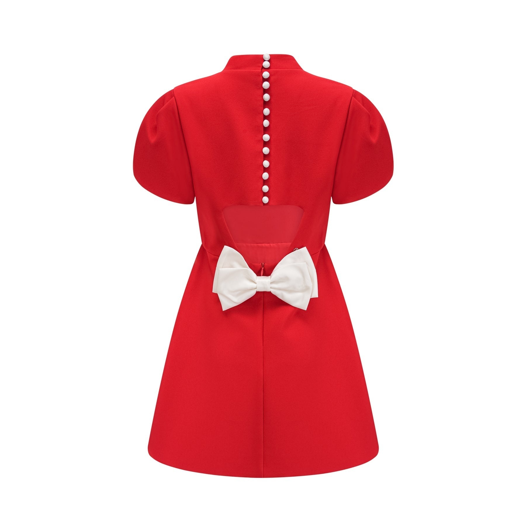 Woman wearing red mini dress with petal sleeves cut out details and bow accent