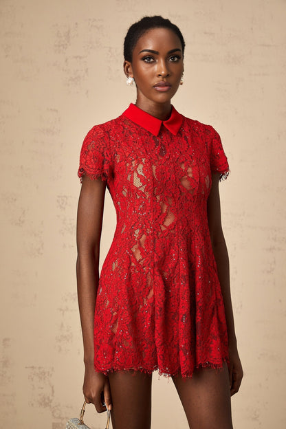 Woman wearing red mini dress with sequined lace detail