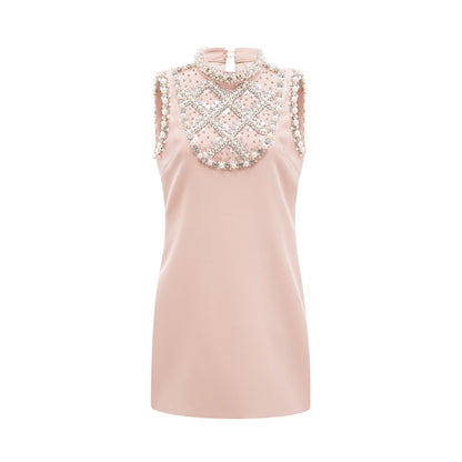 Pink dress with sleeveless design crystal and faux pearl embellishments and thigh length fastened at the rear Composed of 80% Polyester and 20% Cotton