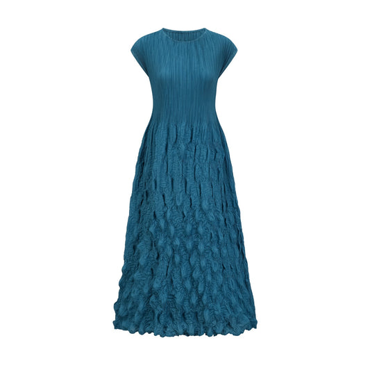 Woman wearing sleeveless midi dress with allover bubble pattern design in light fabric