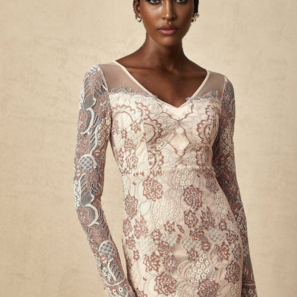 Woman wearing white fitted midi dress with floral guipure lace pattern