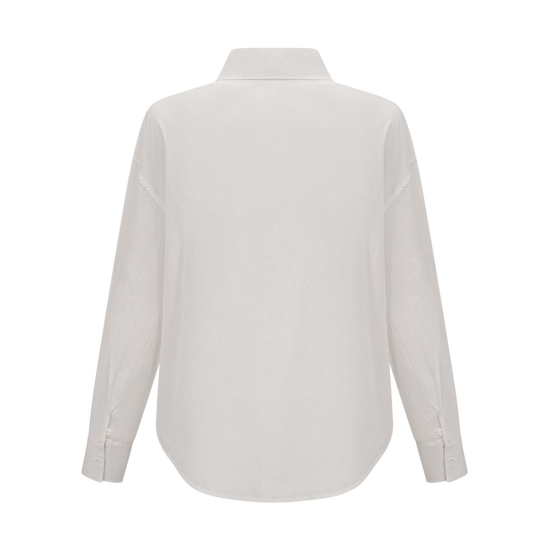 Woman wearing white shirt with floral pattern and cutout details