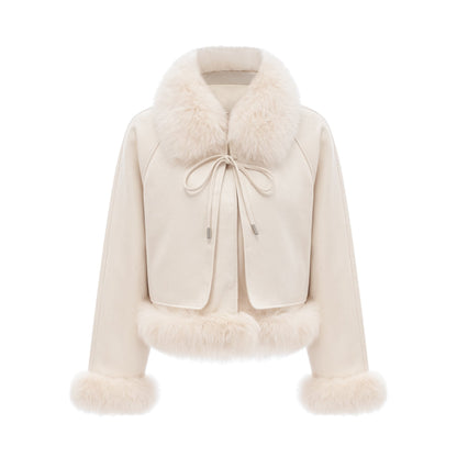 Woman wearing white suede short coat with fur trim and padded design