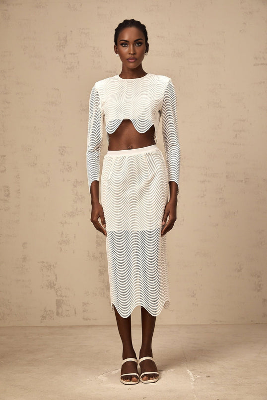 Woman wearing white wavy woven top and matching skirt set called Constance