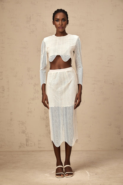 Woman wearing white wavy woven top and matching skirt set called Constance
