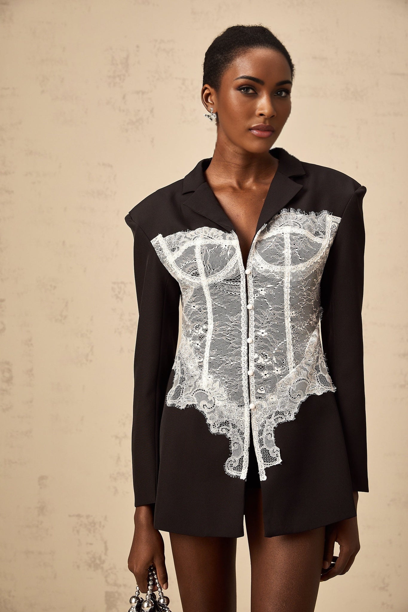 Womens colorblocked blazer with lace panels in contrasting colors featuring a tailored fit and long sleeves
