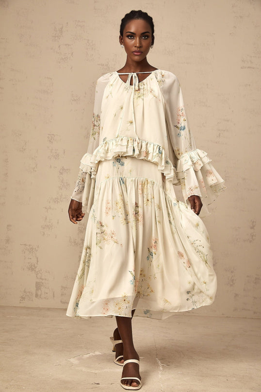 Womens matching set featuring a floral print blouse with ruffles and a coordinating dress in the same pattern