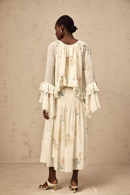 Womens matching set featuring a floral print blouse with ruffles and a coordinating dress in the same pattern