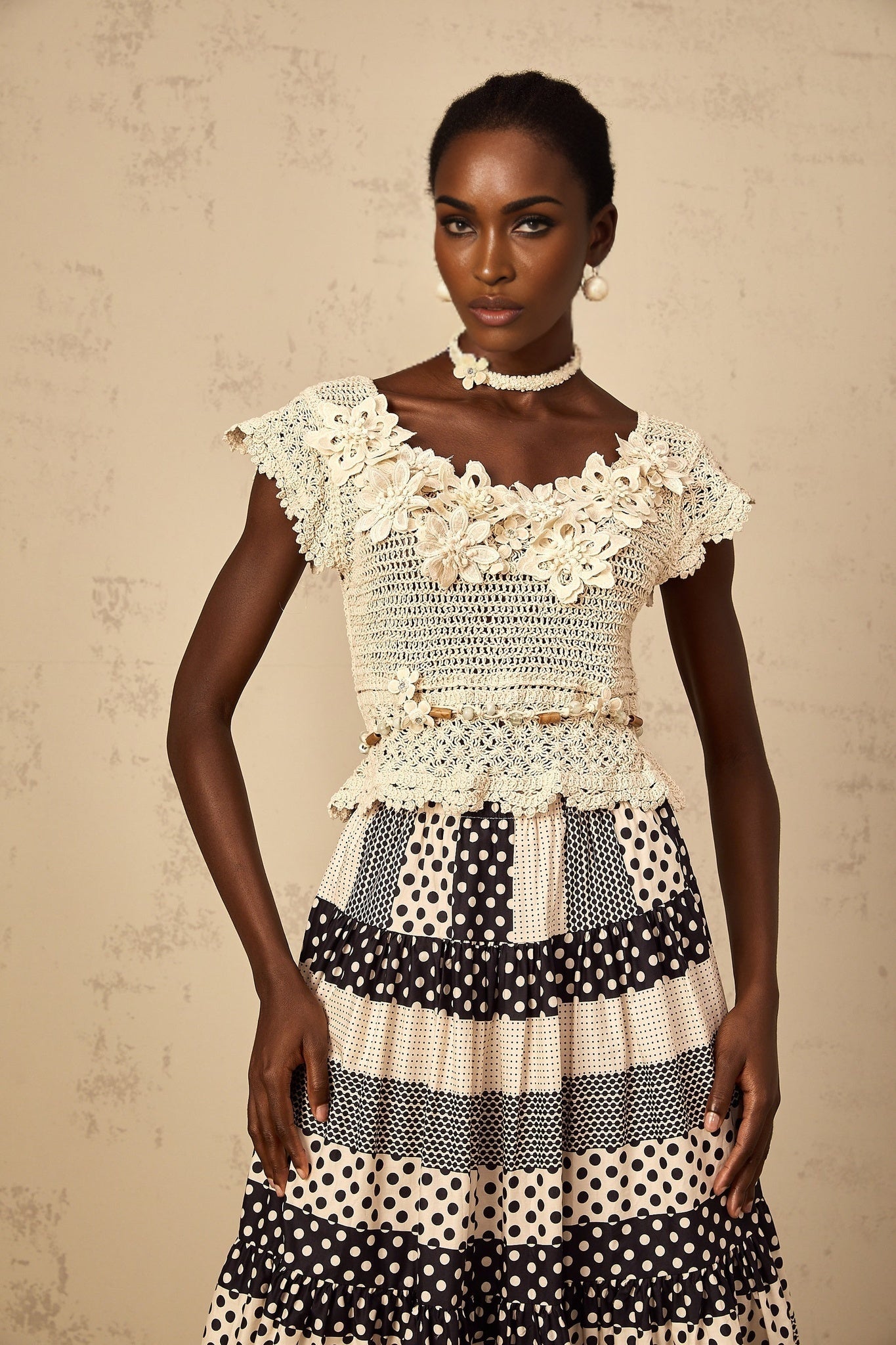 Womens sleeveless knit top with colorful 3D floral beading detail and crochet pattern