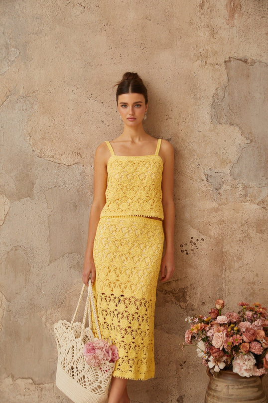 Yellow crochet knit top and skirt set matching outfit with intricate pattern