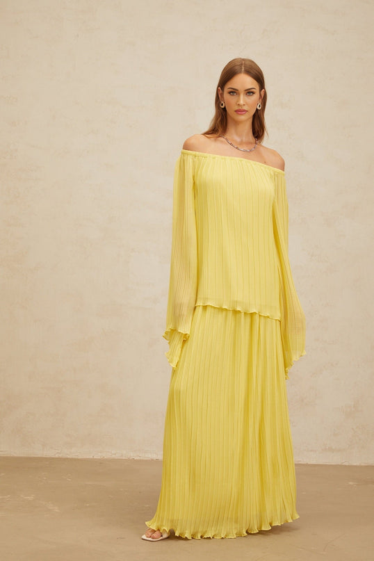 Yellow off the shoulder blouse and maxi skirt set with ruffled hem and pleats made of 100% Terylene fiber