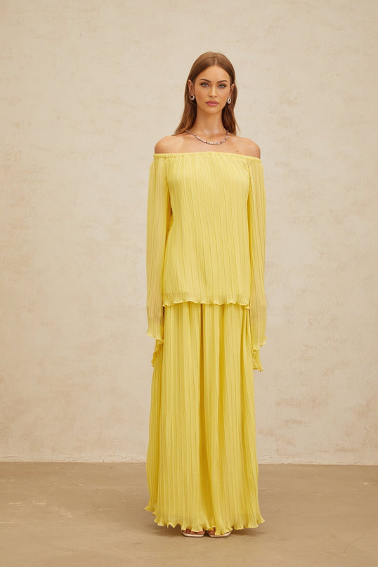Yellow off the shoulder blouse and maxi skirt set in Terylene fiber material