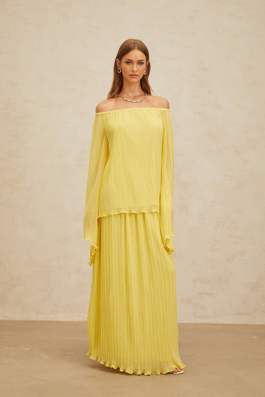 Yellow off the shoulder blouse and skirt set in 100% Terylene fiber with ruffled hem and pleated design